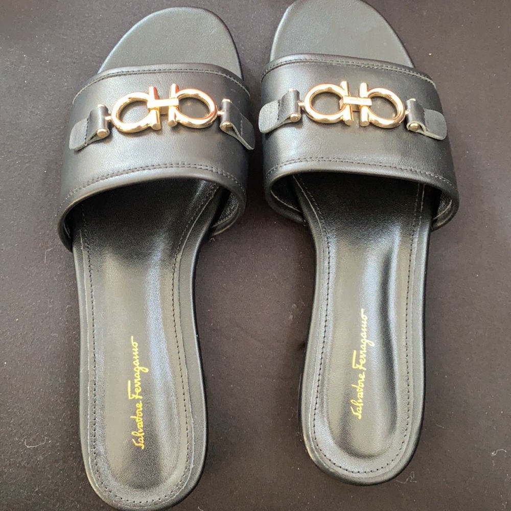Ferragamo black sandals with gold buckle detail